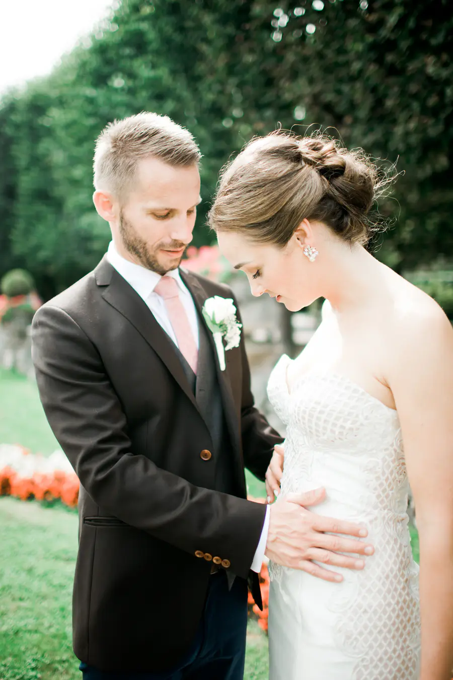 Unposed and genuine portrait of a couple during their wedding session in the gardens, highlighting a photojournalistic approach.