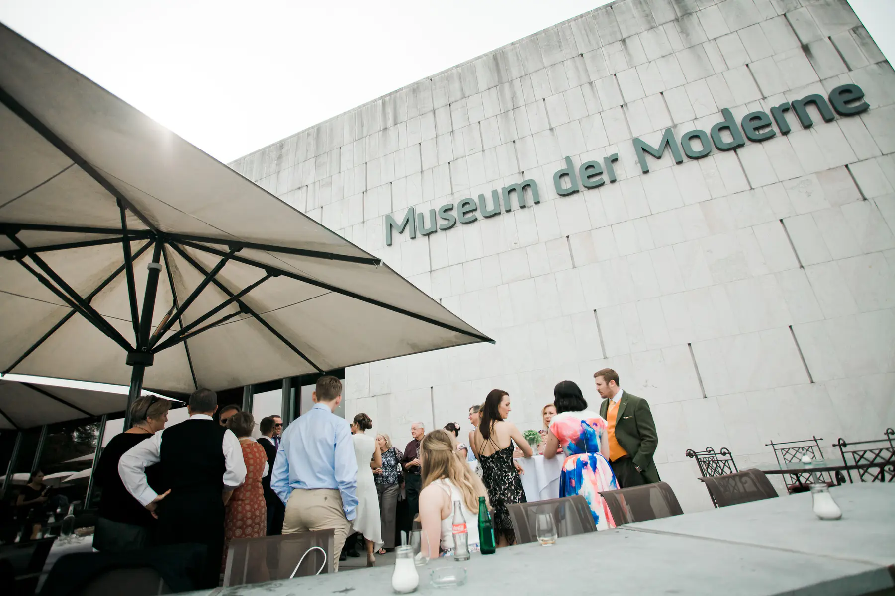 A clean, minimalist shot of the Museum der Moderne facade, highlighting the contemporary stone architecture that serves as a unique wedding backdrop.