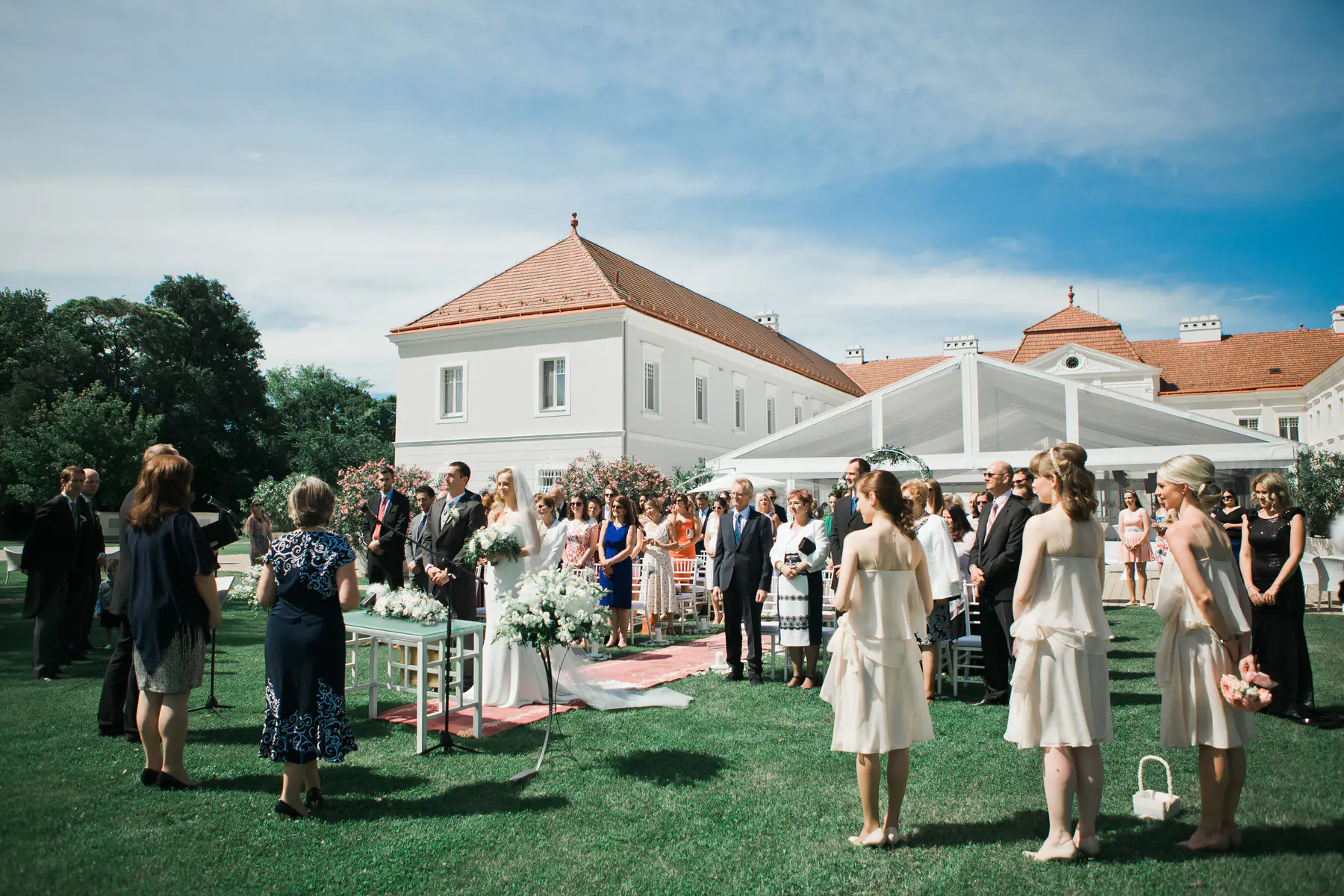 Beautiful wedding ceremony setup in park at Art Hotel Kastiel during a bright summer day.