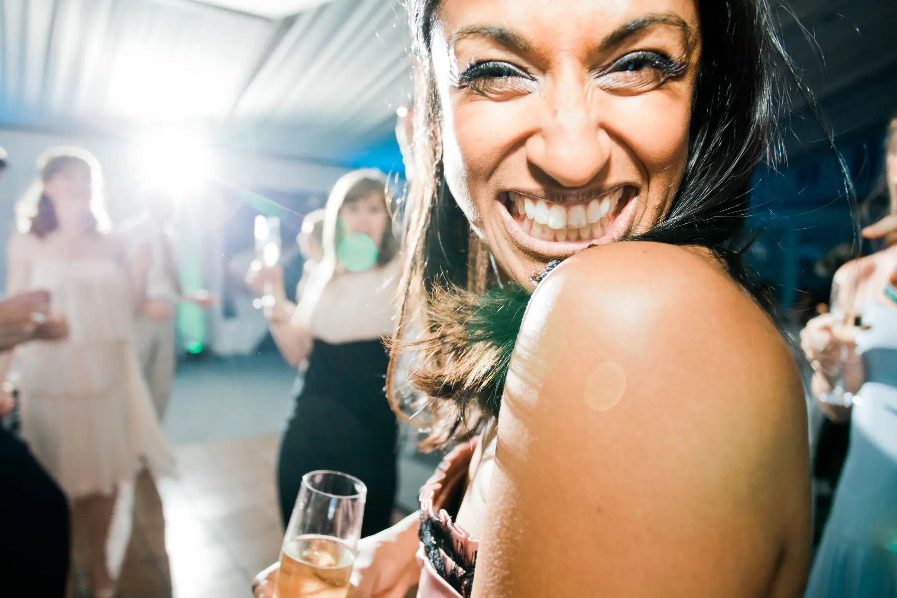 details of smiling wedding guest before party, strobist photography
