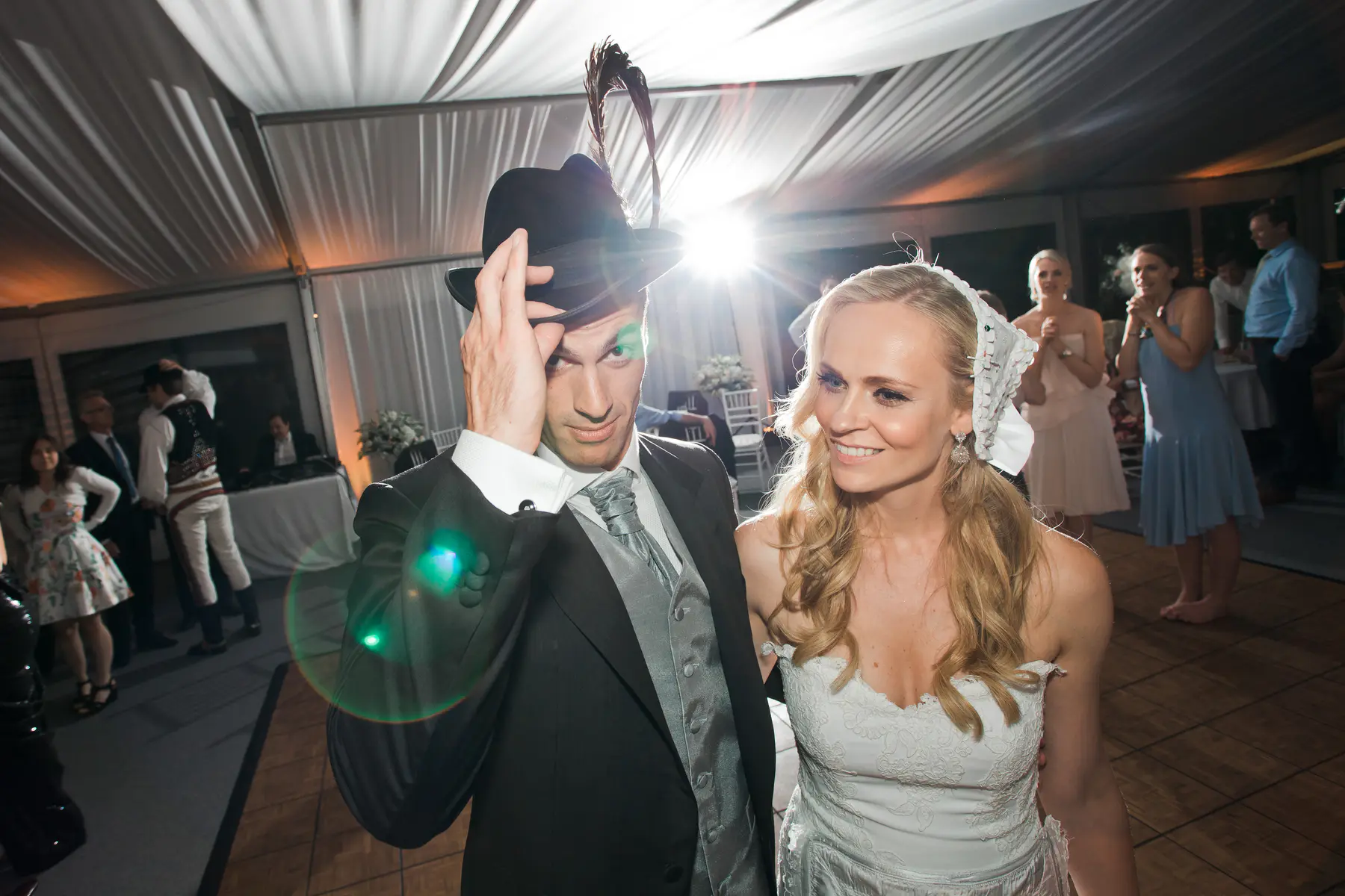 Creative and edgy wedding portrait of a bride and groom with a hat, captured by a photography duoMarek and Klára in Tomášov.