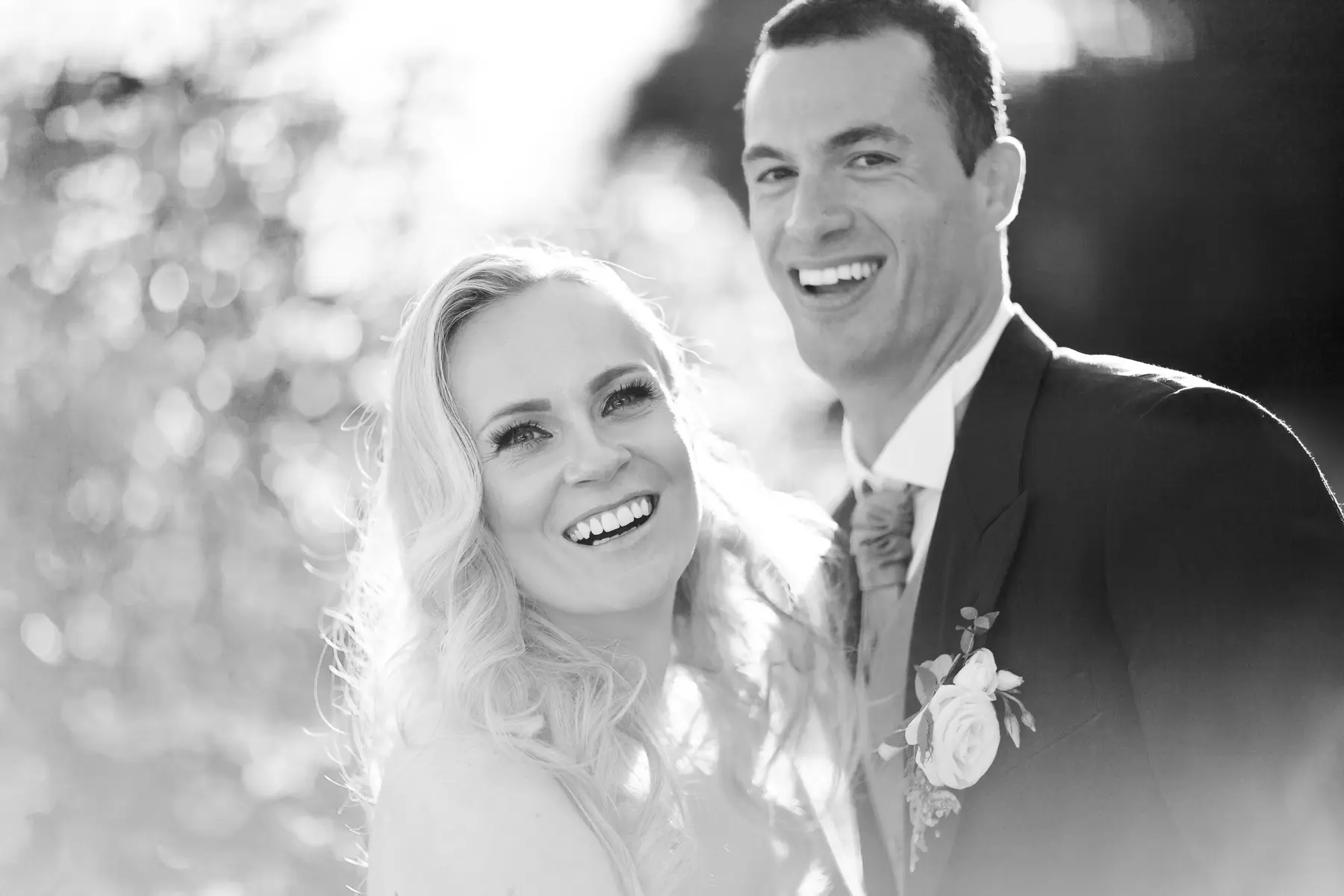 Beautiful backlight portrait of a couple during the golden hour, natural and emotional wedding photography.