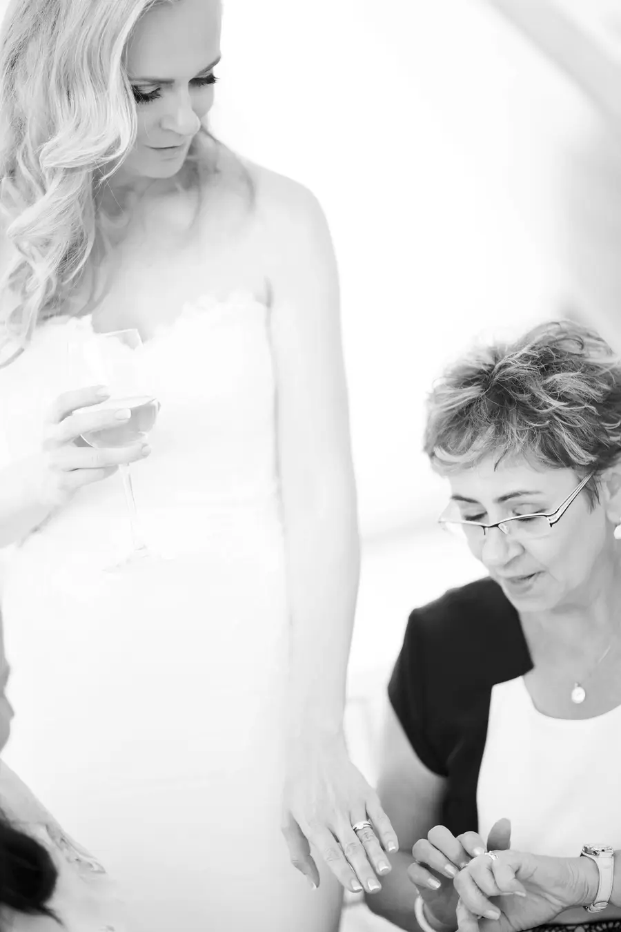 Bride showing her new wedding ring to her mather