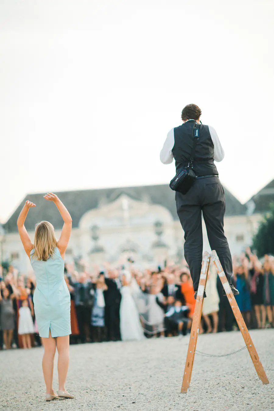 Wedding photographer capturing high angle group shot from a ladder, Marek Valovic wedding photographer Austria